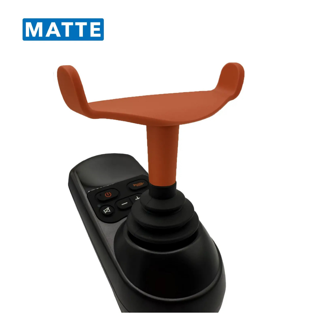 A close-up of the ComfyGo Ergonomic U-Shaped Joystick Handle with Flex Shaft for Powerchairs, shown in black with a matte finish and multiple buttons. A blue box labeled MATTE appears in the top left corner.